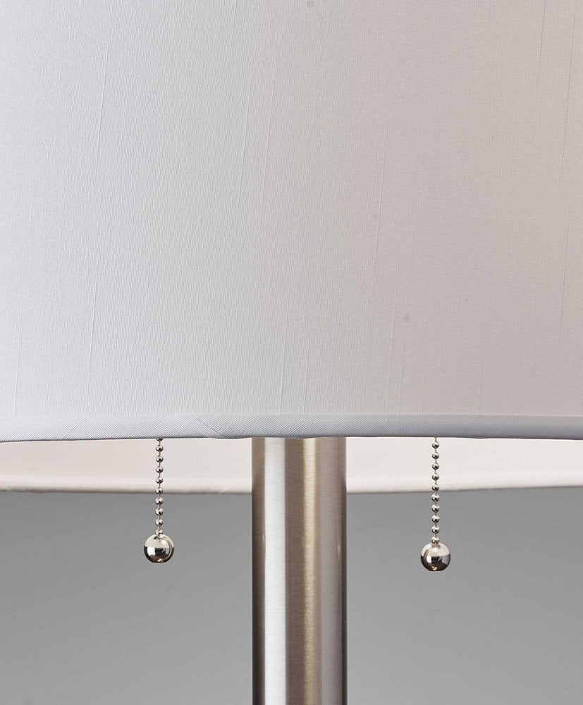 28" Silver Metal Two Light Bedside Table Lamp With White Drum Shade. Table lamp isolated on a plain white background, in a silver metal finish.
