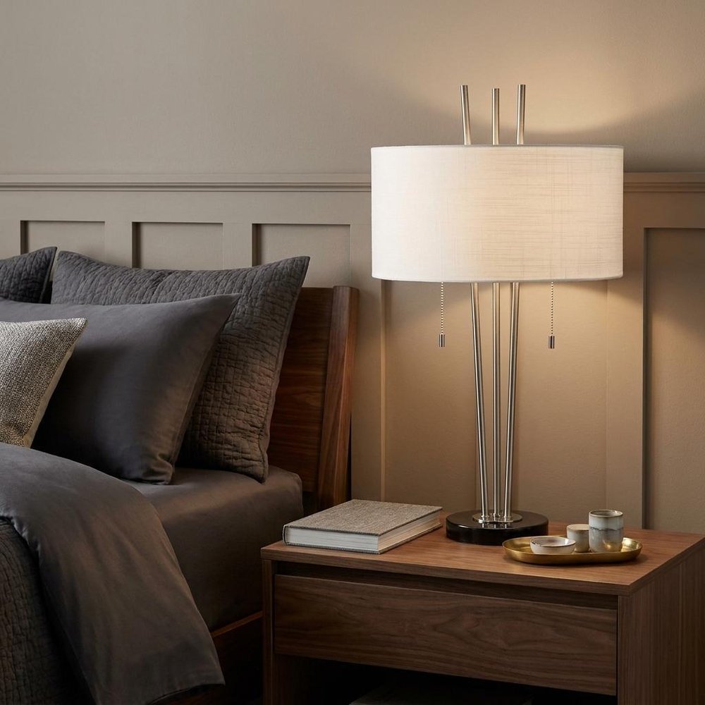 Stylish Triple Pole Brushed Steel Metal Table Lamp in a home interior