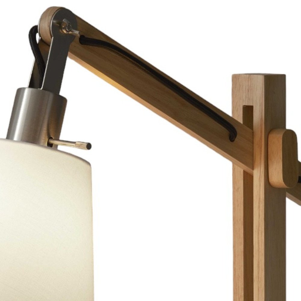 25" Natural Wood Adjustable Height Table Lamp With White Bell Shade. Table lamp isolated on a plain white background, finished in white wood.