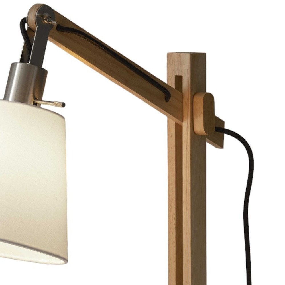 25" Natural Wood Adjustable Height Table Lamp With White Bell Shade. Table lamp isolated on a plain white background, showing a white wood surface.