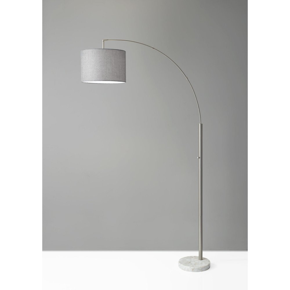 74" Brass Metal Arc Floor Lamp With Off White Linen Drum Shade on a white background