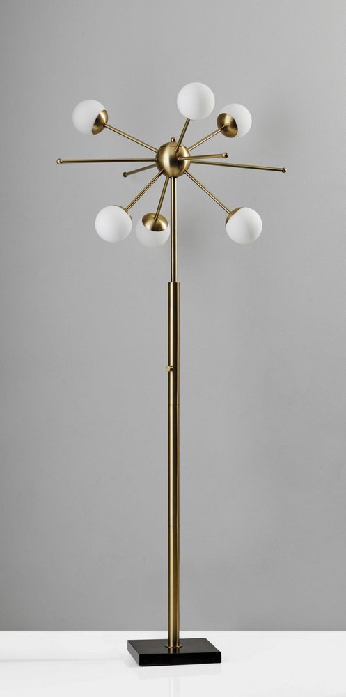 64" Brass Six Light LED Novelty Floor Lamp With White Glass Globe Shades close-up highlighting the glass surface.