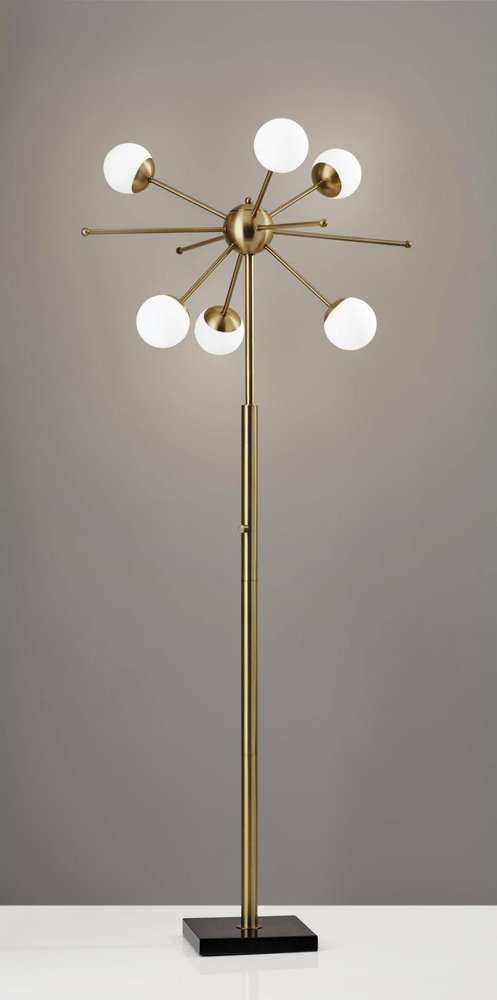 Close-up of 64" Brass Six Light LED Novelty Floor Lamp With White Glass Globe Shades showing the white glass texture.