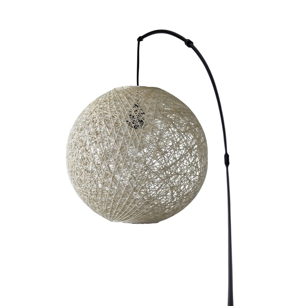 77" Antiqued Bronze Arched Floor Lamp With Groovy Beige Abstract Wicker Globe Shade on a white background