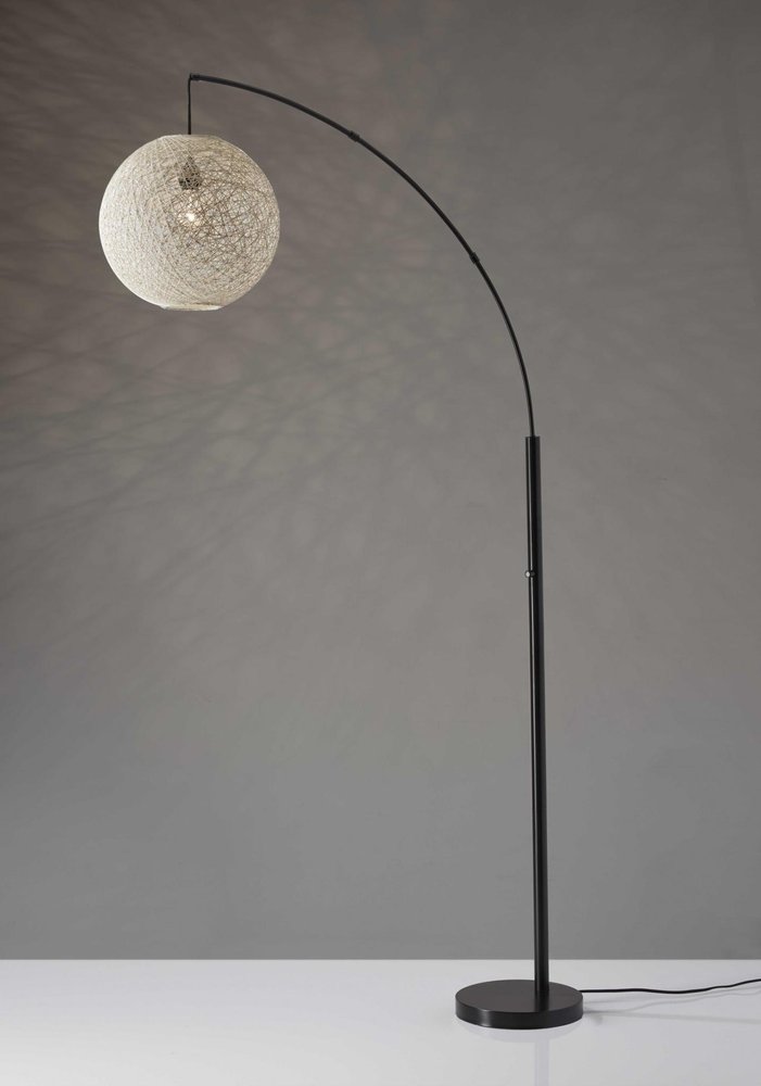 77" Antiqued Bronze Arched Floor Lamp With Groovy Beige Abstract Wicker Globe Shade close-up detail
