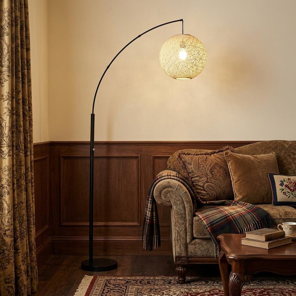 77" Antiqued Bronze Arched Floor Lamp With Groovy Beige Abstract Wicker Globe Shade in a home interior
