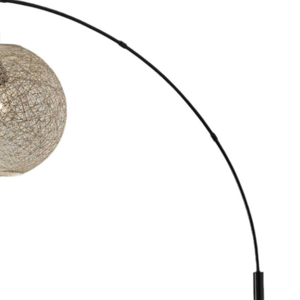 77" Antiqued Bronze Arched Floor Lamp With Groovy Beige Abstract Wicker Globe Shade on a white background