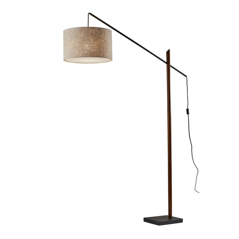77" Beige And Black Swing Arm Floor Lamp With Beige Fabric Drum Shade on a white background
