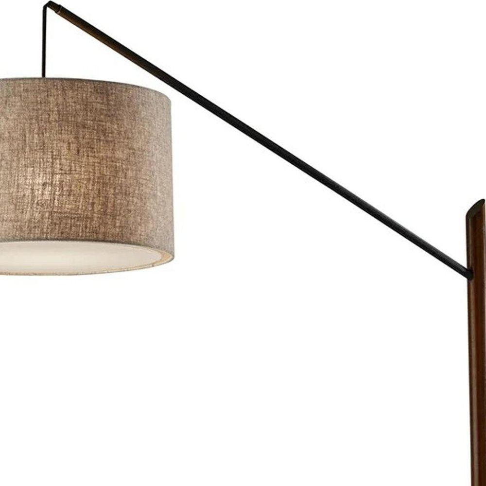 77" Beige And Black Swing Arm Floor Lamp With Beige Fabric Drum Shade on a white background