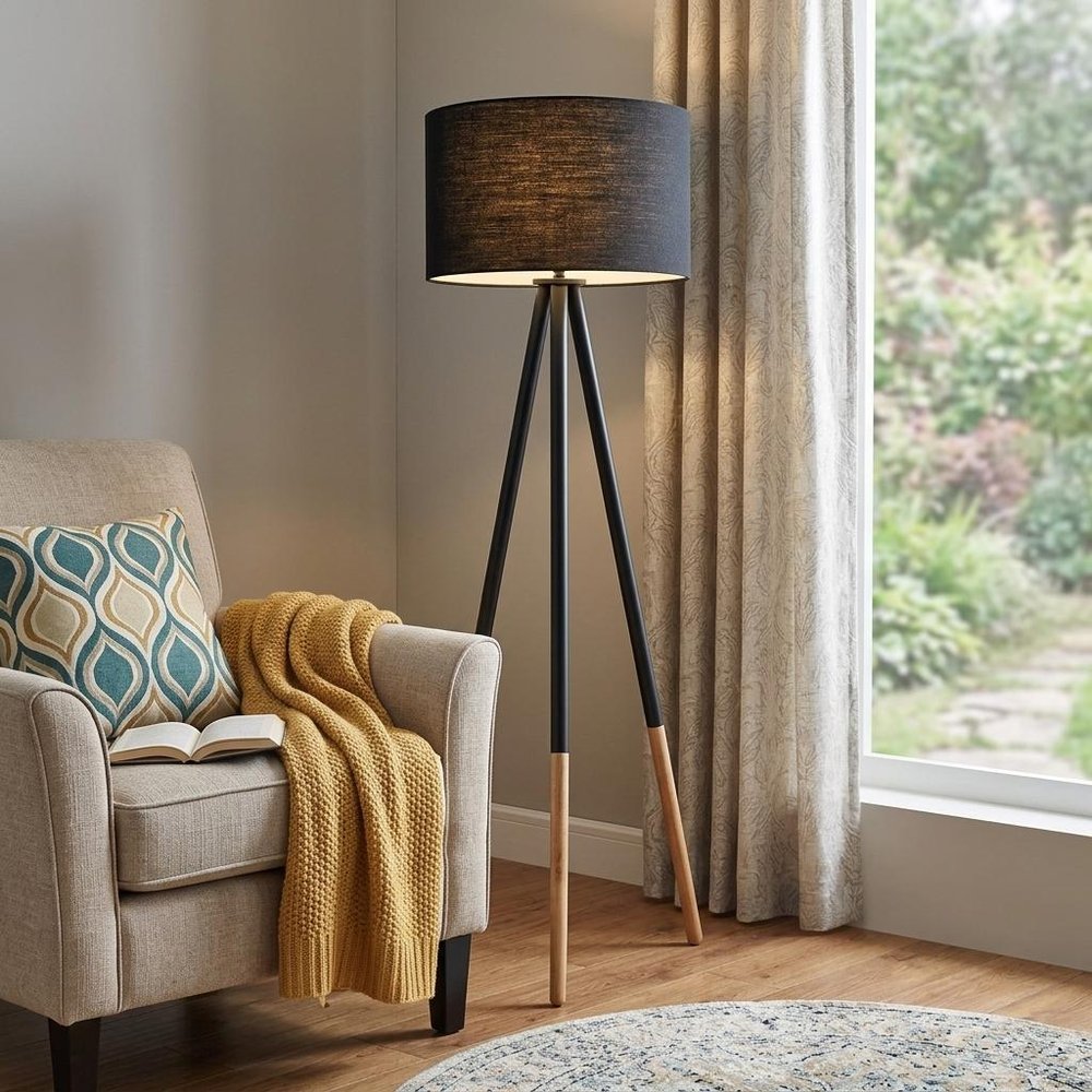 Black Metal Tripod Floor Lamp With Black Fabric Drum Shade - 60.25" H x 22.00" W x 22.00" D in a home interior