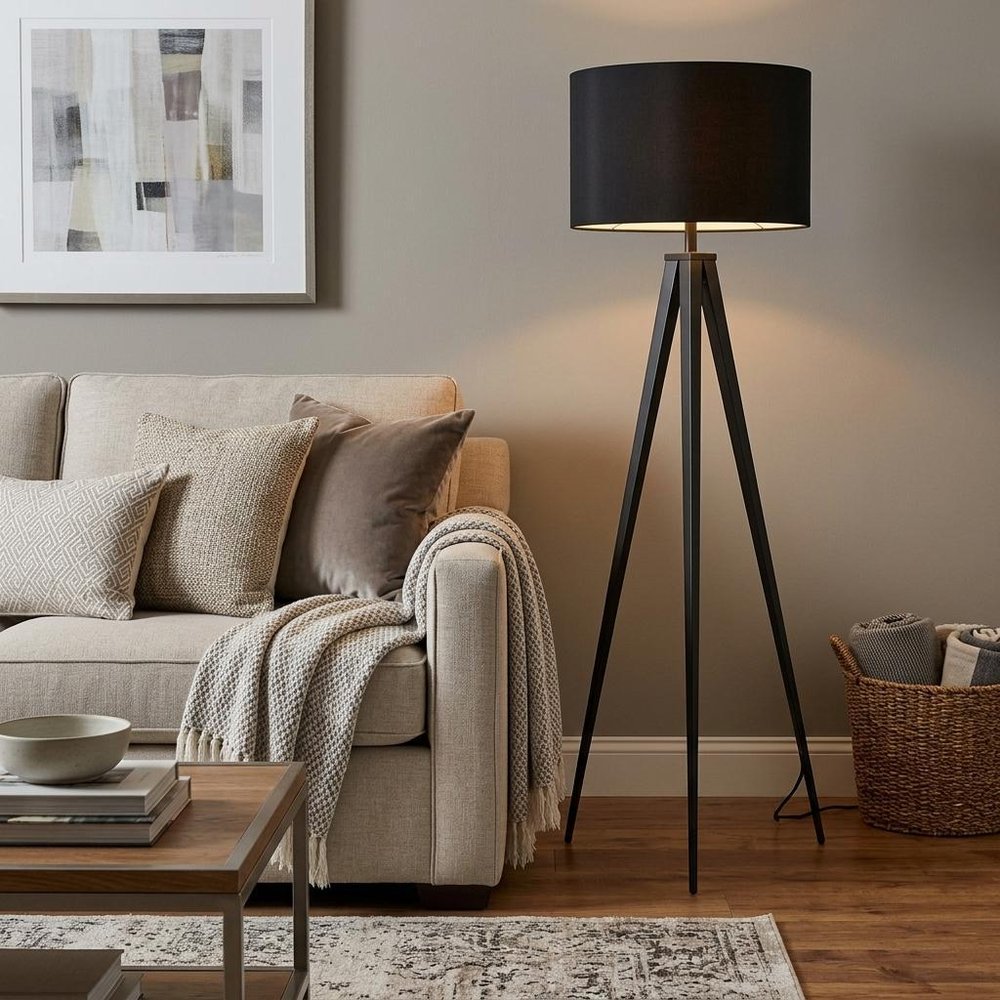 Black Metal Tripod Floor Lamp With Black Fabric Drum Shade in a home interior