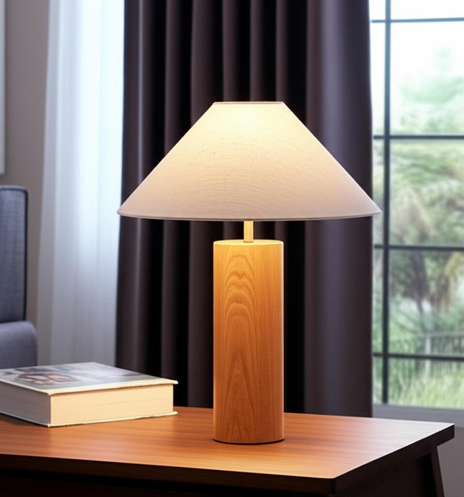 26" Natural Solid Wood Cylinder Table Lamp With White Cone Shade shown outdoors on an outdoor setting with greenery.