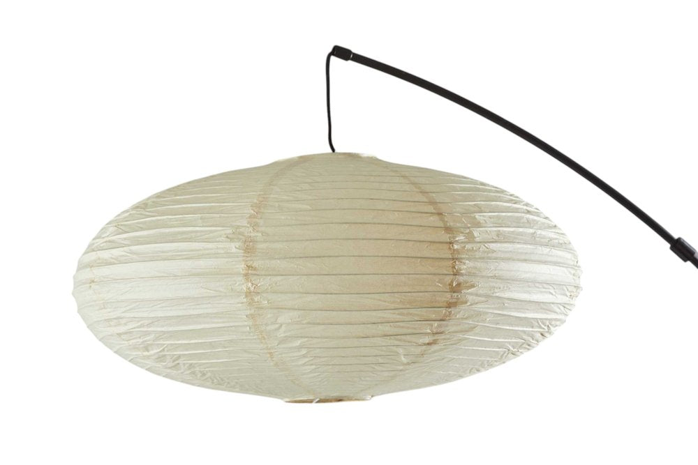 80" Beige And Black Arc Floor Lamp With Beige Paper Globe Shade on a white background