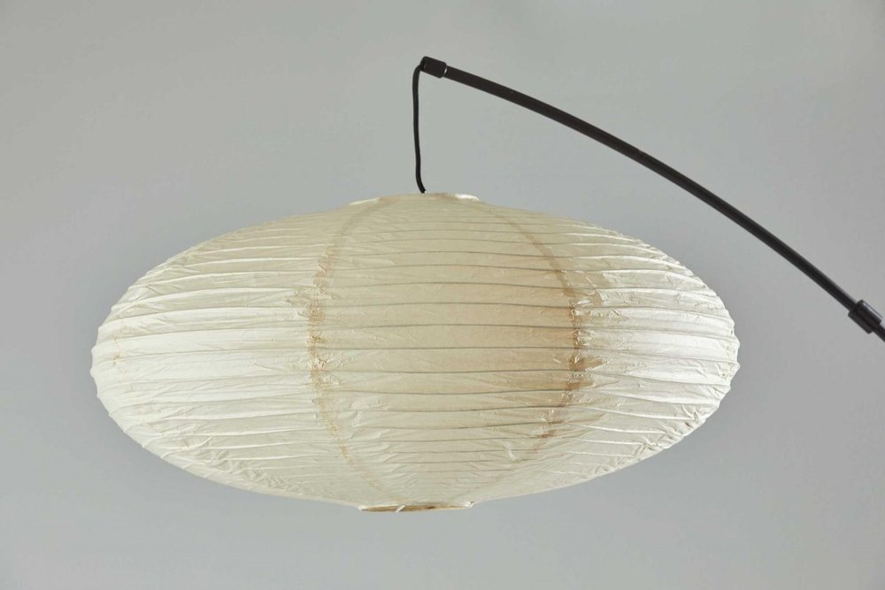80" Beige And Black Arc Floor Lamp With Beige Paper Globe Shade on a white background
