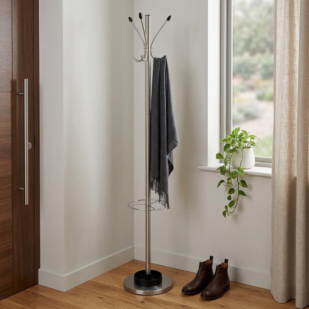 13" X 68" Brushed Steel Brushed Steel Stand Coat Rack styled in a furnished interior with a light gray wall on a dark wood floor.