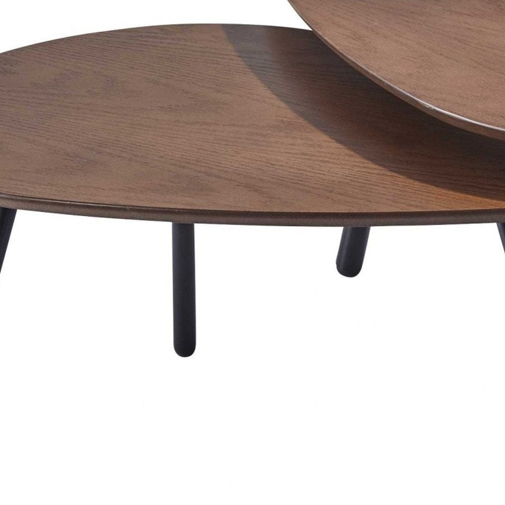 Set of Two Brown And Black Wood And Metal Oval Nested Tables on a white background