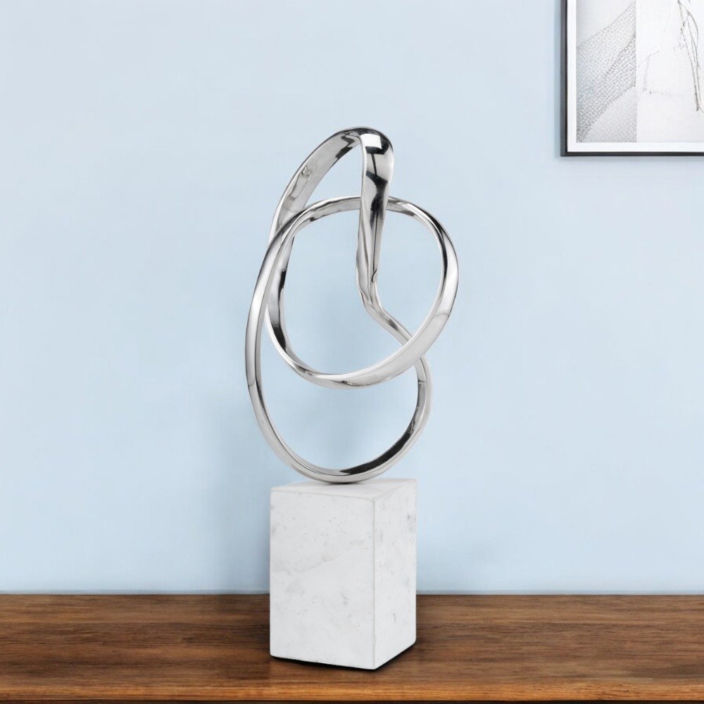 18" Silver and White Marble and Aluminum Sculpture shown outdoors on an outdoor setting.