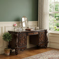 67" Brown Vanity Table With Seven Drawers styled in a furnished interior with a green wall on a dark wood floor.