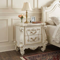 31" White Wood Two Drawer Nightstand styled in a furnished interior with a cream wall on a dark wood floor.