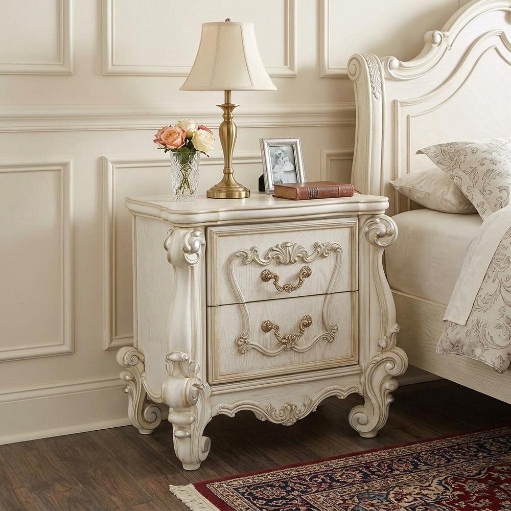 31" White Wood Two Drawer Nightstand styled in a furnished interior with a cream wall on a dark wood floor.