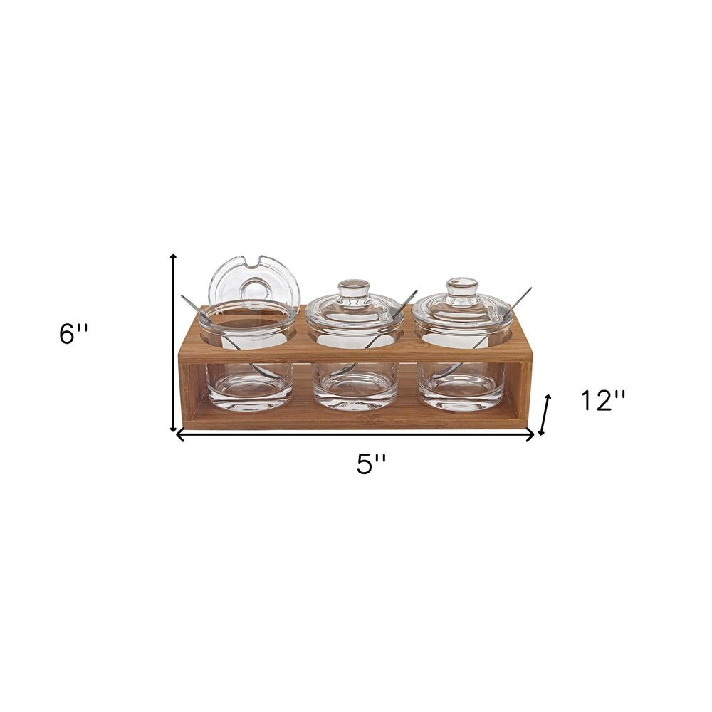 6 Mouth Blown Crystal Jam Set With 3 Glass Jars And Spoons On A Wood Stand. Kitchen accessory isolated on a plain white background, finished in clear glass.