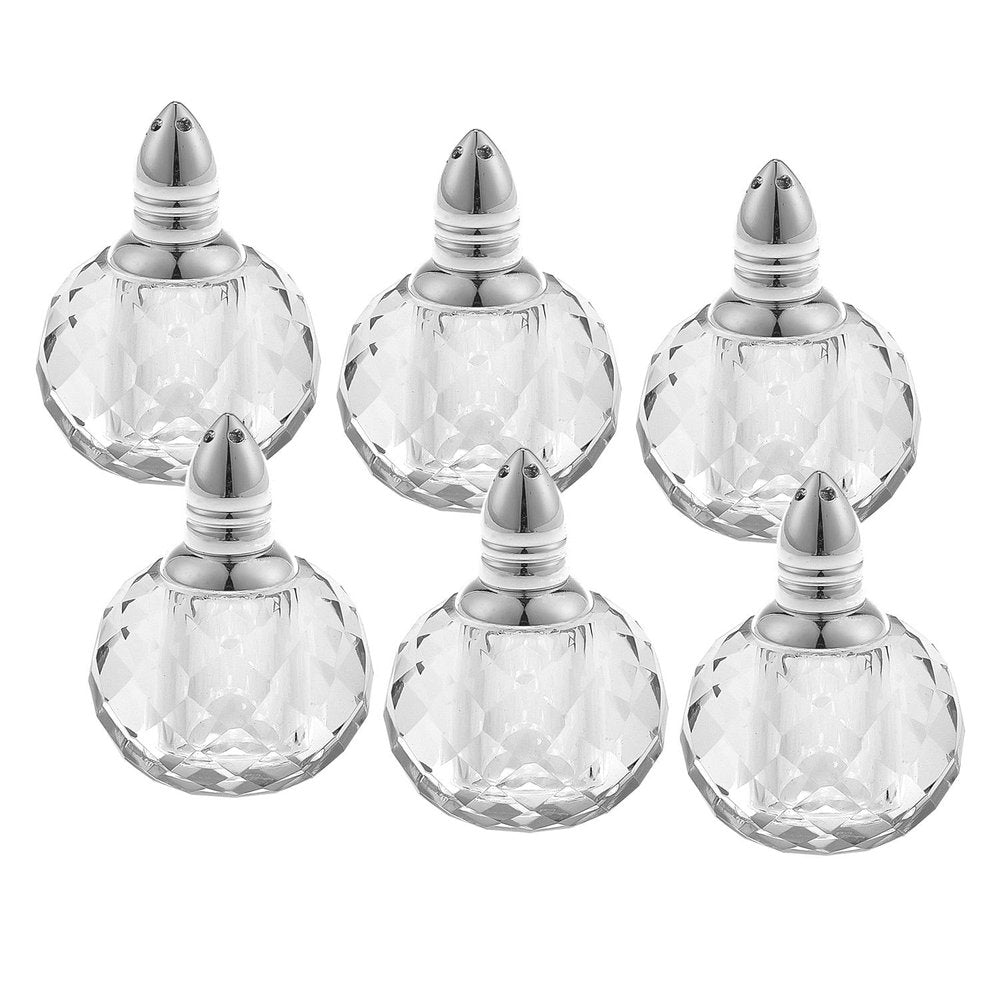 Set of six round cut crystal salt and pepper shakers with silver tops on a white background.