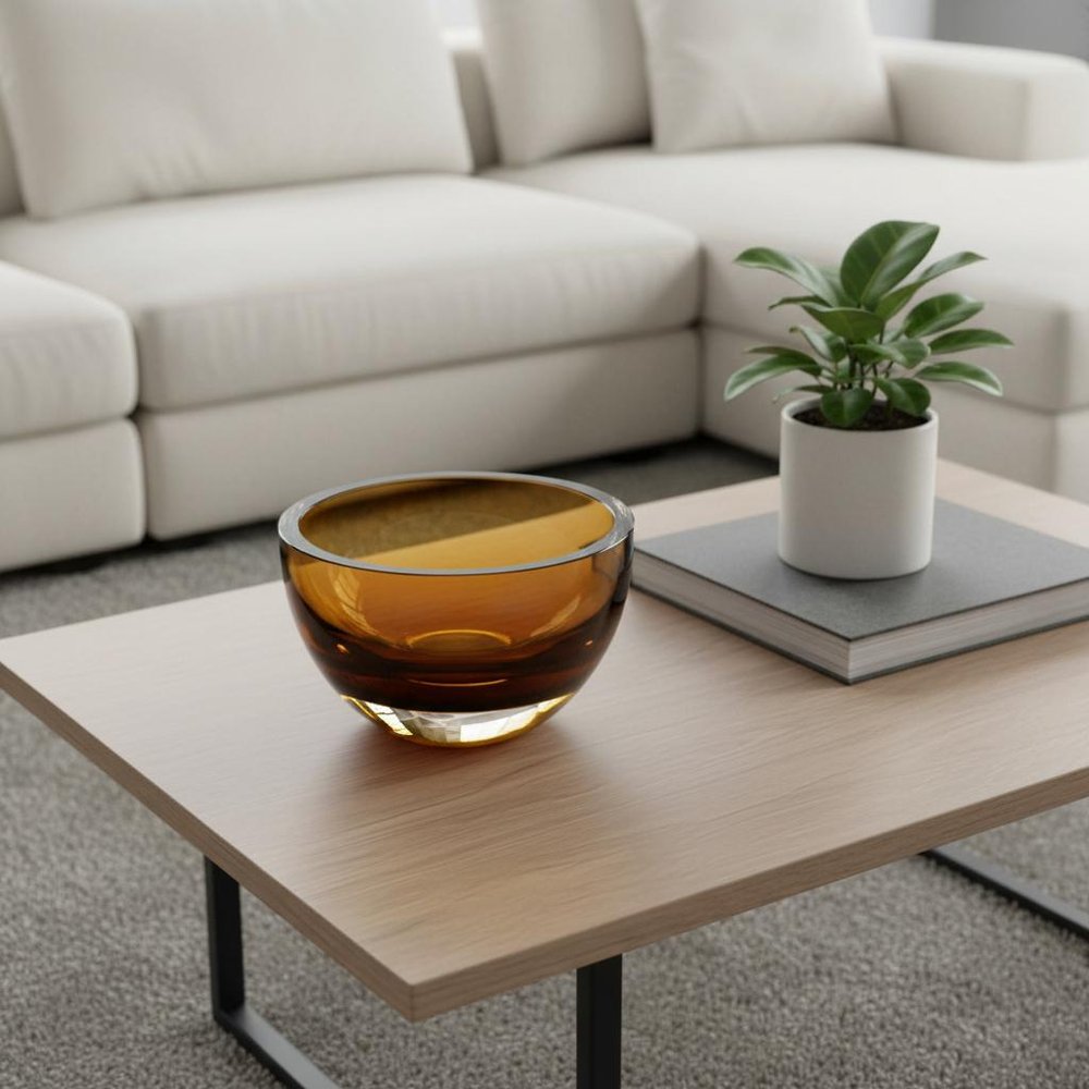 6" Amber Mouth Blown Crystal Thick Walled Bowl styled in a furnished interior with a light gray wall on a tiled floor in gray crystal.