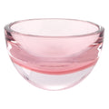 A pink mouth-blown crystal bowl with thick walls on a white background.