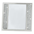 Silver tabletop picture frame with crystal accents and a white background.