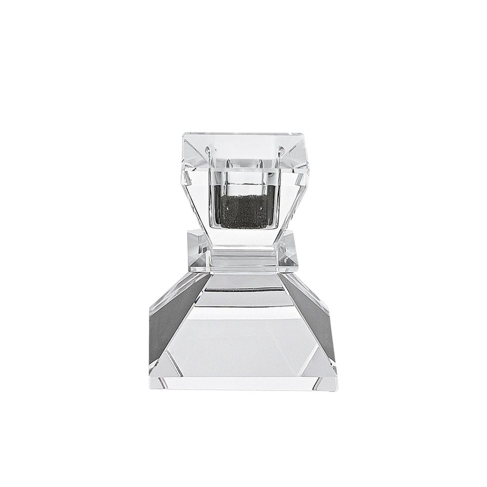 Clear crystal taper candlestick with a dark interior on a white background