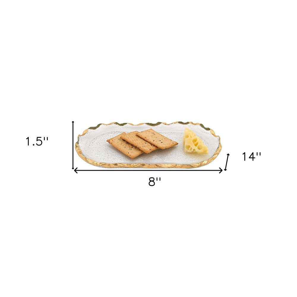 14 Glass Oval Edge Gold Leaf Platter. Dinnerware isolated on a plain white background, finished in gold glass.
