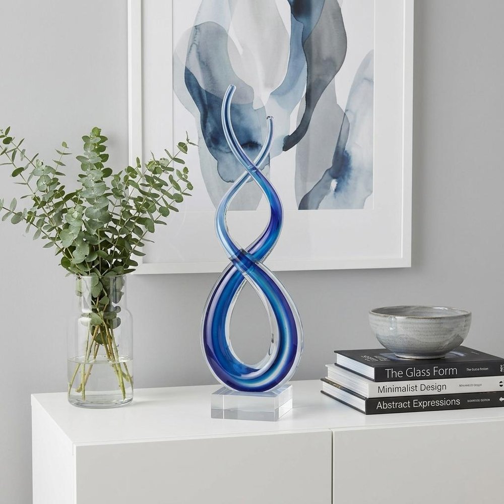 11" Clear and Blue Murano Glass Modern Abstract Tabletop Sculpture. Sculpture isolated on a plain white background, finished in clear glass.