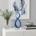 11" Clear and Blue Murano Glass Modern Abstract Tabletop Sculpture. Sculpture isolated on a plain white background, finished in clear glass.