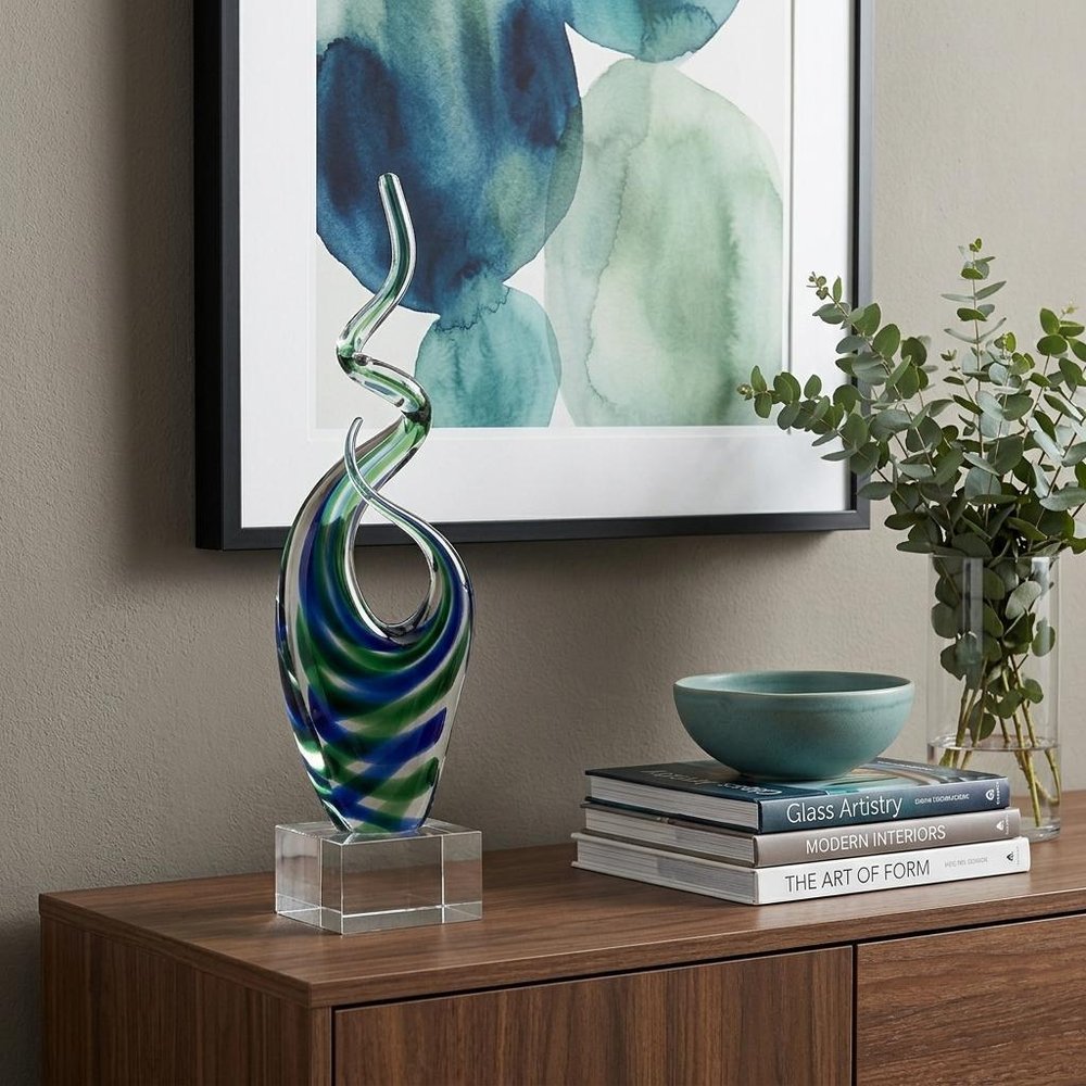 14" Clear Blue and Green Murano Glass Modern Abstract Tabletop Sculpture shown outdoors on an outdoor setting with greenery.