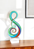 12" Clear and Rainbow Murano Glass Modern Abstract Tabletop Sculpture. Sculpture isolated on a plain white background, showing a glass surface.
