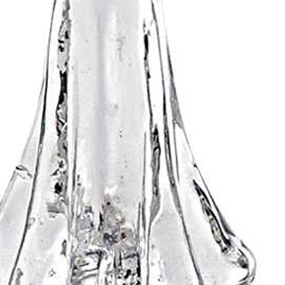 12" Mouth Blown Clear Glass Christmas Tree Sculpture. Sculpture isolated on a plain white background, showing a clear glass surface.