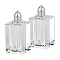 Set of Two Clear And Silver Crystal Pepper Shakers on a white background