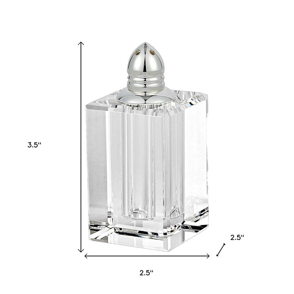 Set of Two Clear And Silver Crystal Pepper Shakers on a white background