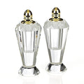 Set of Two Clear And Gold Crystal Geometric Pepper Shakers on a white background
