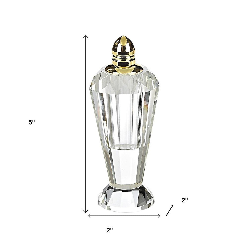 Set of Two Clear And Gold Crystal Geometric Pepper Shakers on a white background