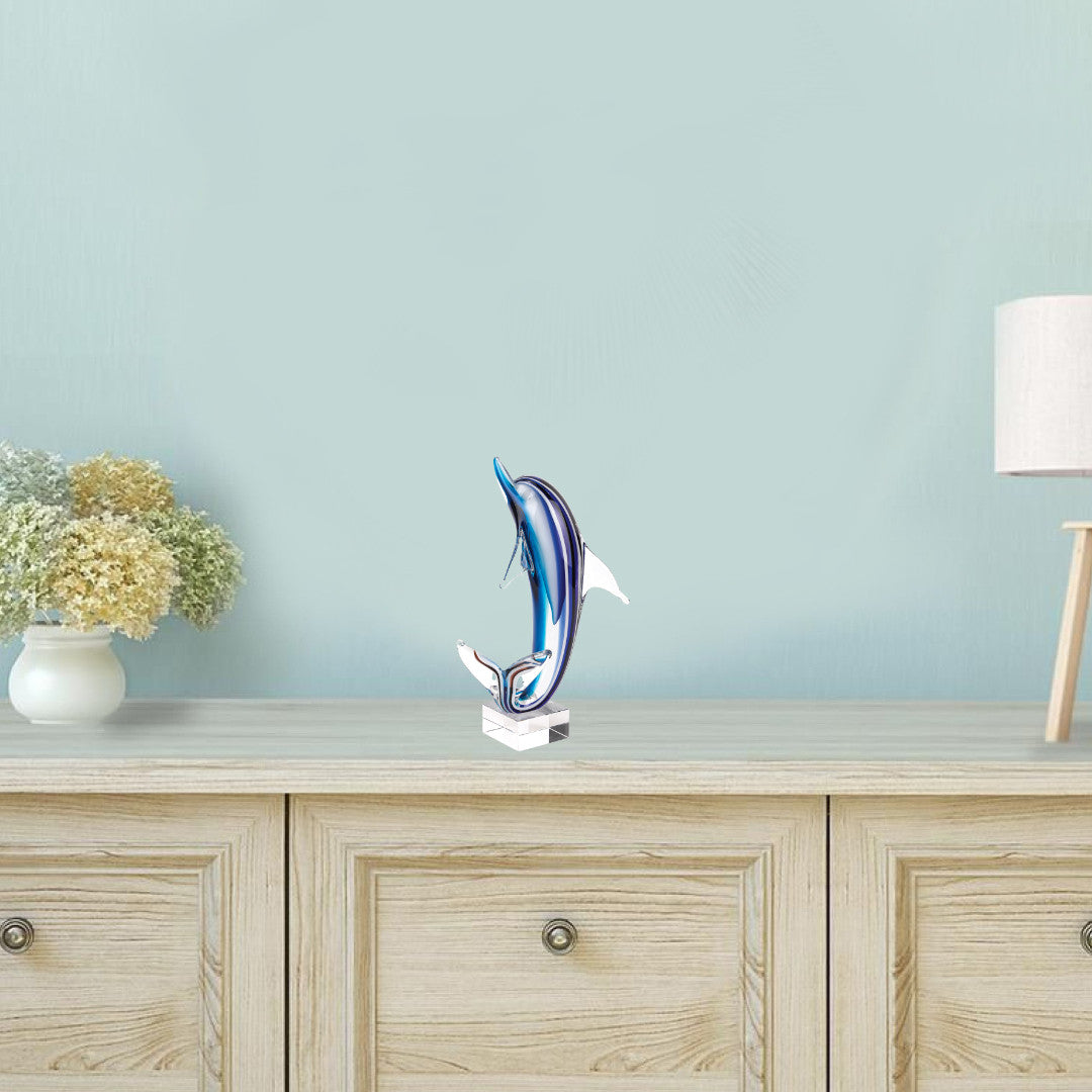 14" Blue Murano Glass Dolphin Figurine Tabletop Sculpture. Sculpture isolated on a plain white background, in a blue glass finish.
