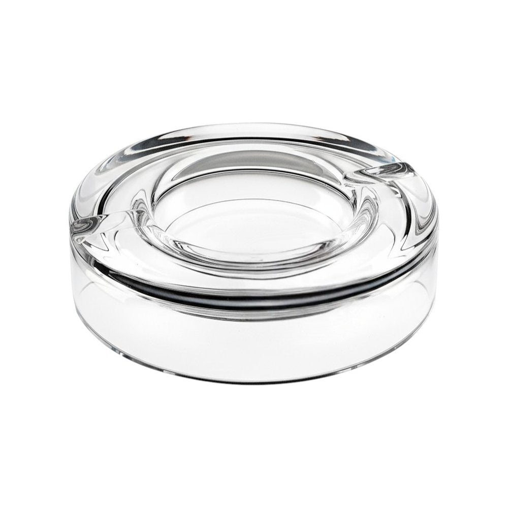 Clear crystal cigar ashtray with four rests on a white background