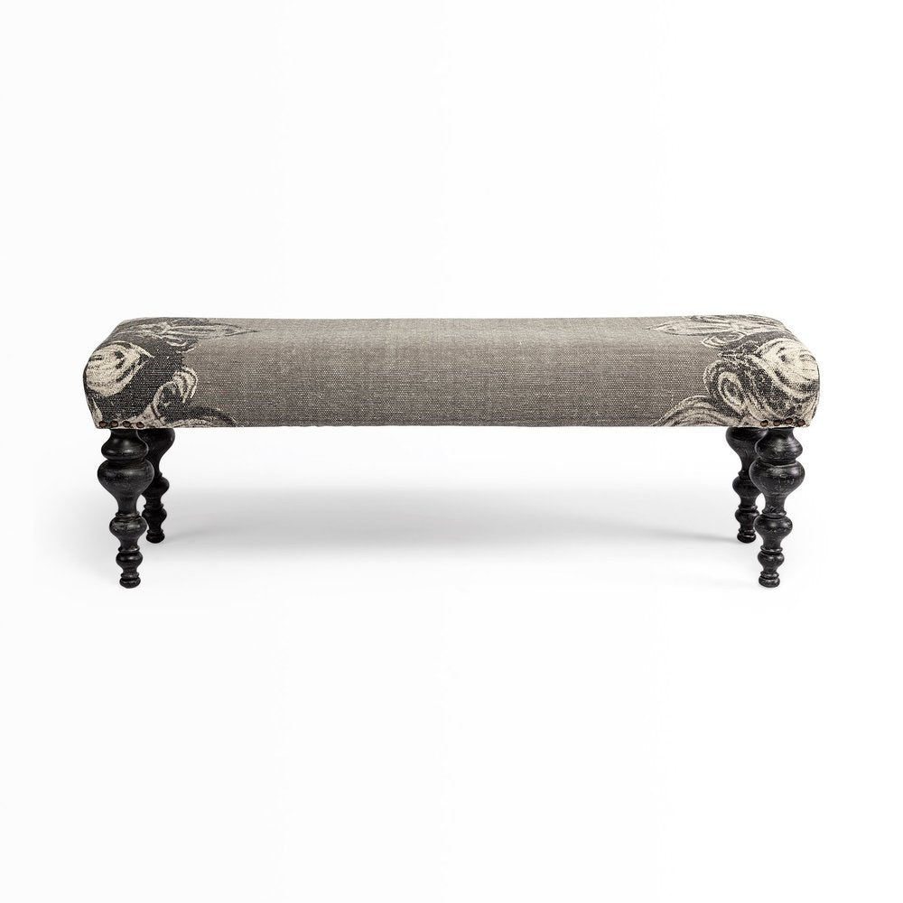 55" Gray and Black Upholstered Cotton Blend Floral Distressed Bench. Bench isolated on a plain white background, showing a gray cotton surface.