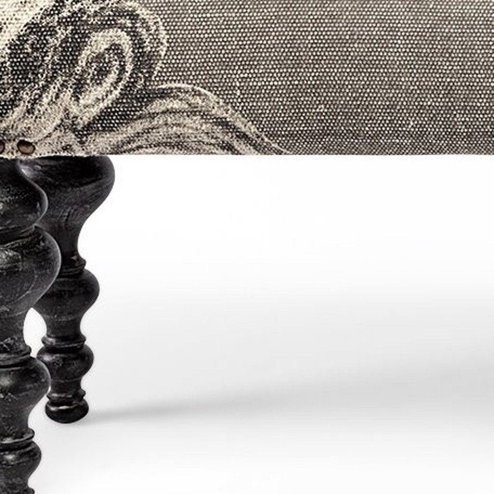 55" Gray and Black Upholstered Cotton Blend Floral Distressed Bench. Bench in black cotton.