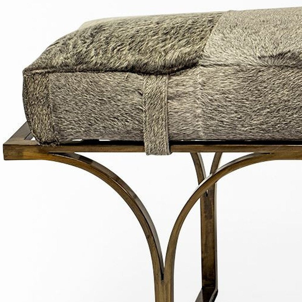55" Gray and Antiqued Brass Faux Fur Upholstery Bench. Bench isolated on a plain white background.