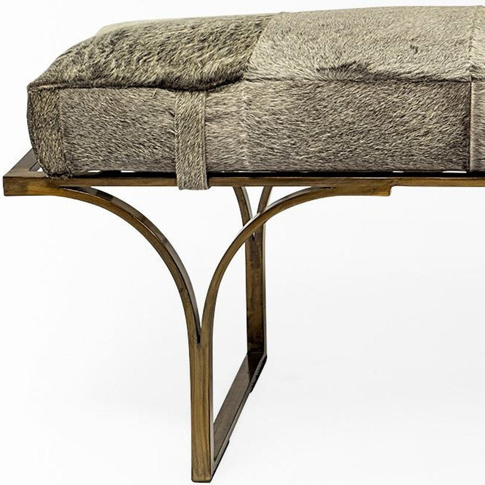 55" Gray and Antiqued Brass Faux Fur Upholstery Bench. Bench isolated on a plain white background.