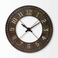 A large, round, industrial-style wall clock with a brown, weathered metal finish and cut-out numbers on a white background.