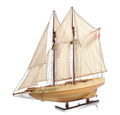 24" Brown Solid Wood Hand Painted Model Boat. Home product isolated on a plain white background, in a brown wood finish.