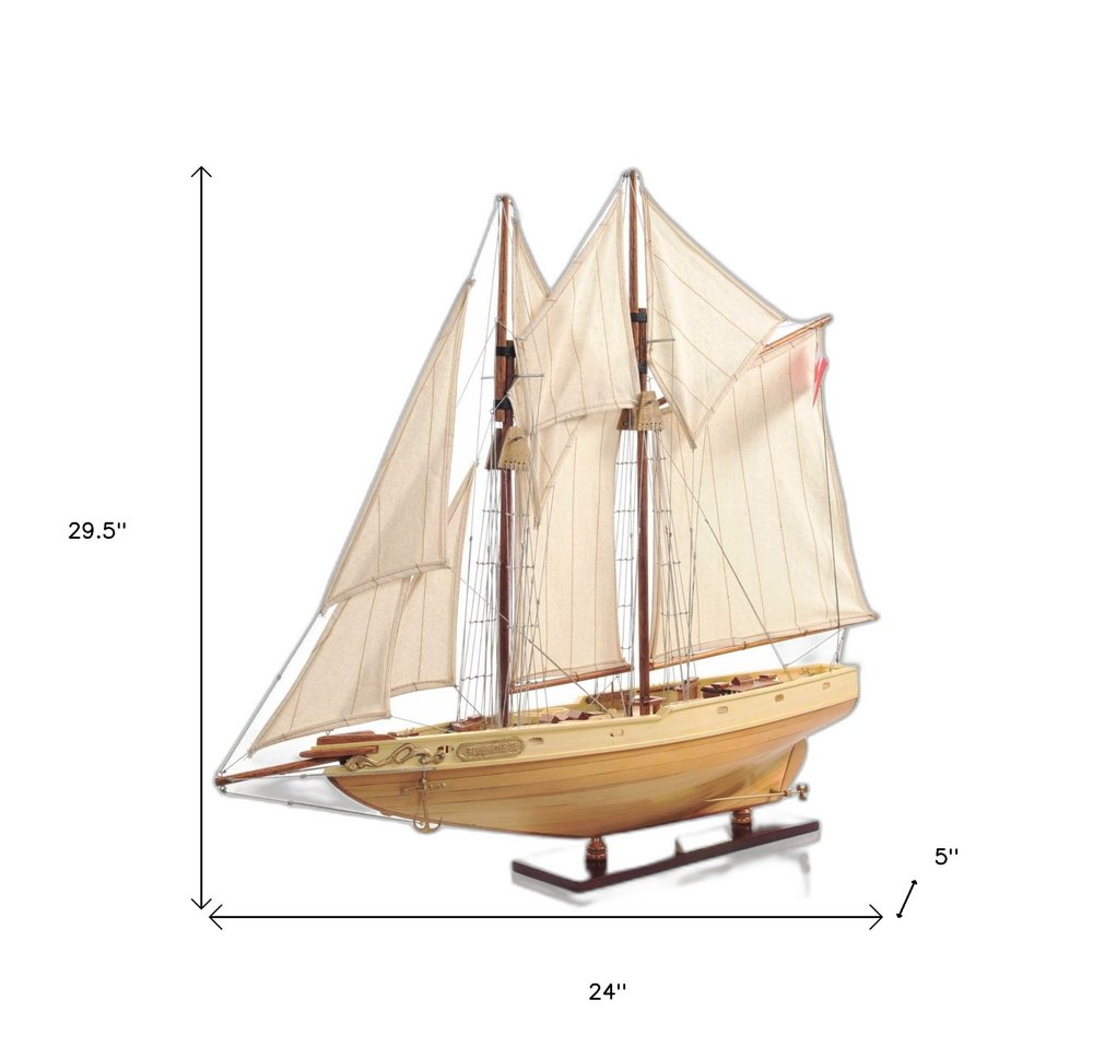 24" Brown Solid Wood Hand Painted Model Boat. Home product isolated on a plain white background, showing a brown wood surface.