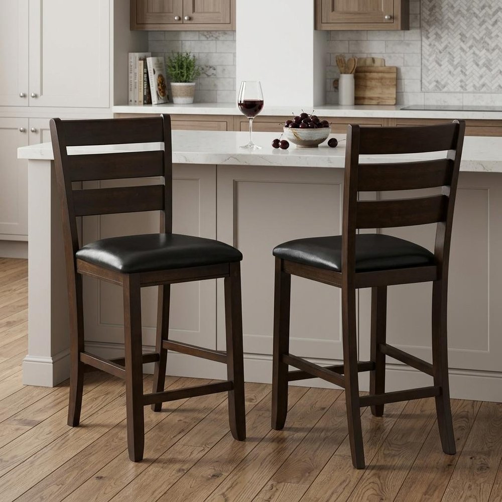Set of Two 41" Black And Brown Faux Leather And Solid Wood Counter Height Bar Chairs in a home interior